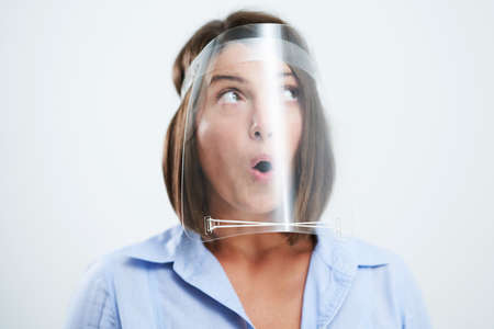Attractive woman wearing protective shield isolated over white background