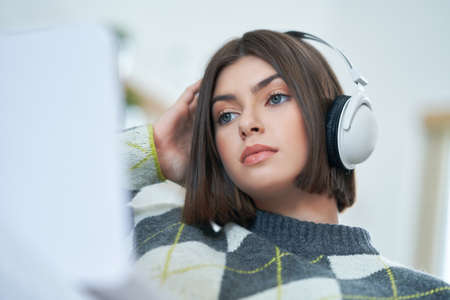 Teenage girl having online classes at home