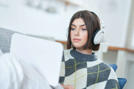 Teenage girl having online classes at home