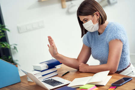 Teenage girl having online classes at home