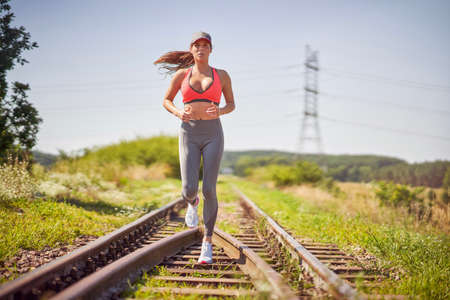 Female jogger running in the countrysideの写真素材