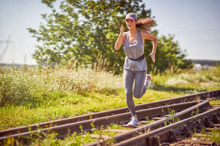 Female jogger running in the countrysideの写真素材