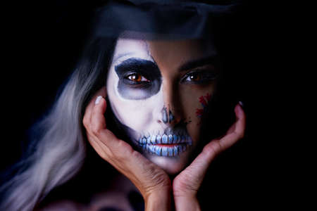 Spooky portrait of woman in halloween gotic makeupの写真素材