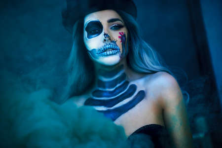 Spooky portrait of woman in halloween gotic makeup