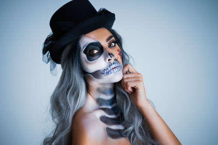 Spooky portrait of woman in halloween gotic makeup