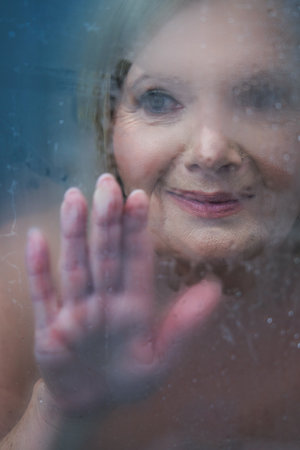 Senior woman taking shower at homeの写真素材