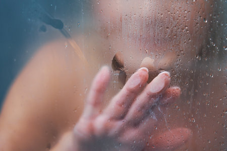 Senior woman taking shower at homeの写真素材