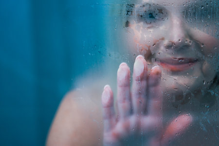 Senior woman taking shower at homeの写真素材