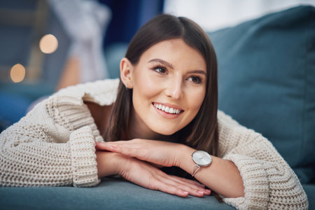 Young sexy woman relaxing at homeの写真素材