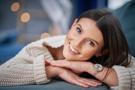 Young sexy woman relaxing at homeの写真素材