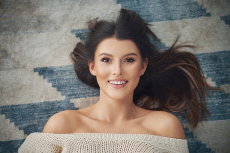 Young sexy woman relaxing at homeの写真素材