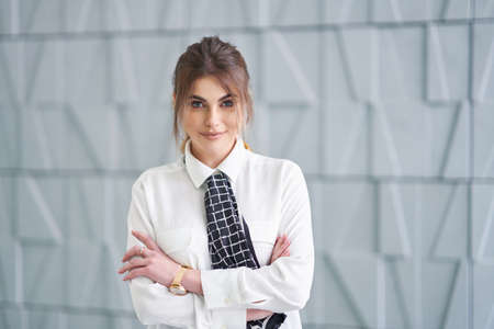 Businesswoman posing over modern backgroundの写真素材