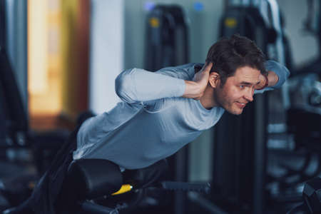 Adult man working out in a gym