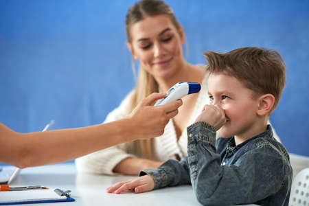 Little boy having medical examination by pediatrician