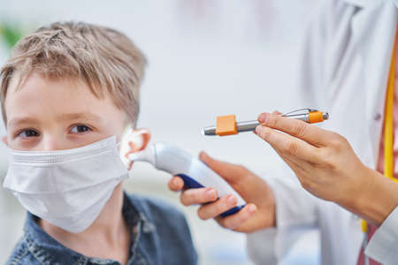 Little boy having medical examination by pediatricianの写真素材