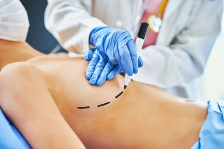 Plastic surgeon consulting a female patientの写真素材