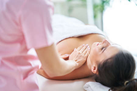 Adult woman during relaxing massage in spaの写真素材
