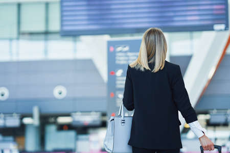 Adult female passenger at the airportの写真素材