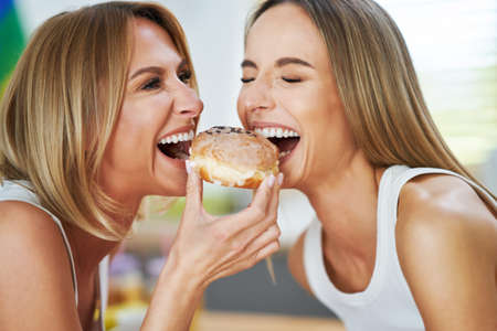 LGBT Lesbian couple love moments in the kitchen happiness concept