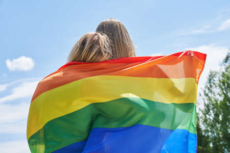 Woman wearing lgbt flag outdoor.の写真素材