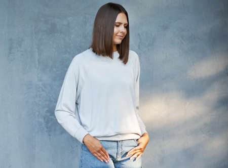 Young woman in gray blouse