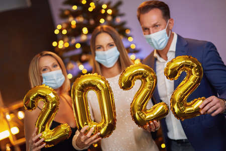 Beautiful young friends having fun at New Years Eve Party 2022