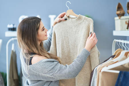 Young girl on shopping during sale holding tagの写真素材