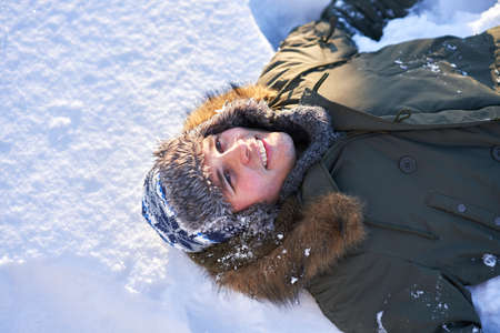 Young person having fun on the snow