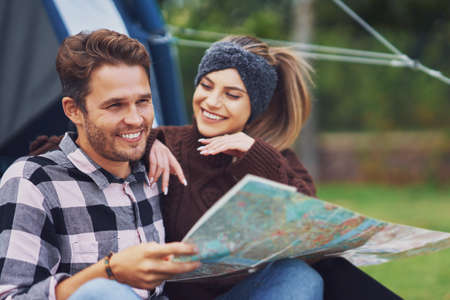 Young nice couple having fun on campingの写真素材