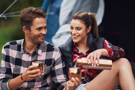 Young nice couple having fun on campingの写真素材