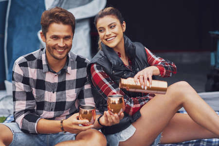 Young nice couple having fun on campingの写真素材