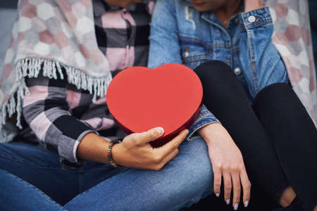 Young nice couple having fun on camping with heart shapeの写真素材