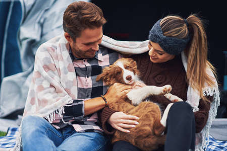 Young nice couple having fun on campingの写真素材