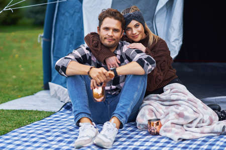 Young nice couple having fun on campingの写真素材