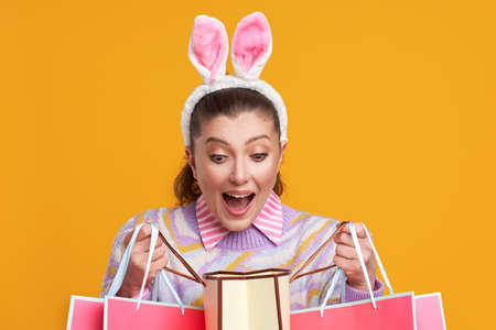 Studio shots of woman over yellow background easter style