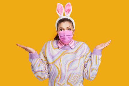 Young nice woman isolated over yellow backgroundの写真素材