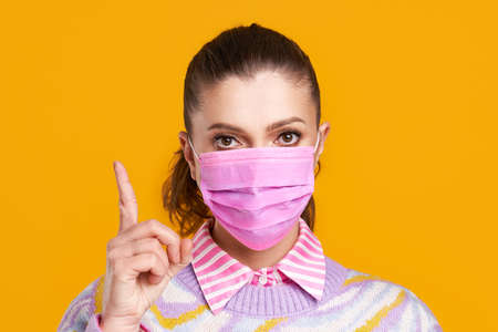 Young nice woman isolated over yellow background