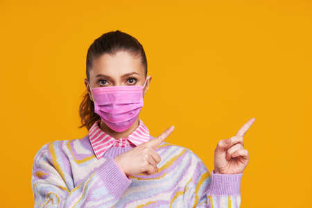 Young nice woman isolated over yellow background