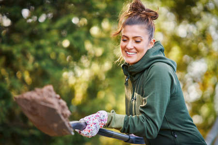 Picture of woman working with tools in the garden