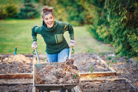 Picture of woman working with tools in the gardenの写真素材