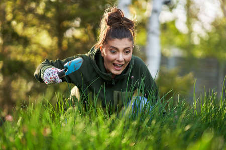 Picture of woman working with tools in the gardenの写真素材