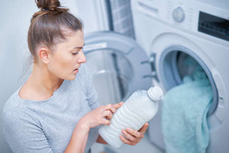 Picture of young woman making laundry workの写真素材