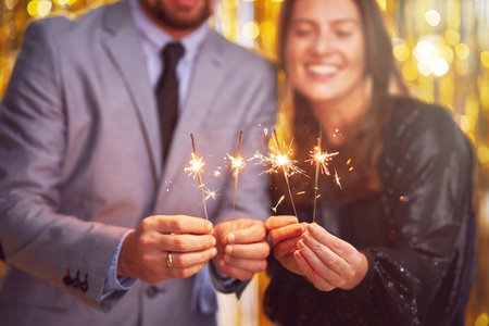 Couple at new year eve party with 2023 sparklersの写真素材