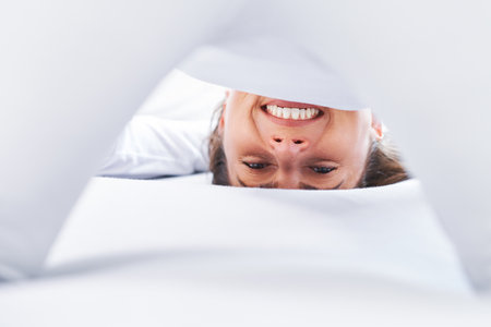 Nice female in bed relaxing or doing yogaの写真素材