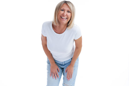 Picture of blonde woman over back isolated background making happy faces