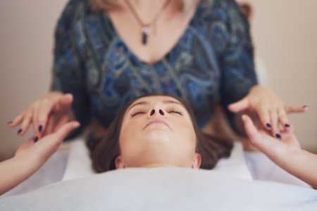 Picture of an treatment that involves gently touching 32 points on your headの写真素材
