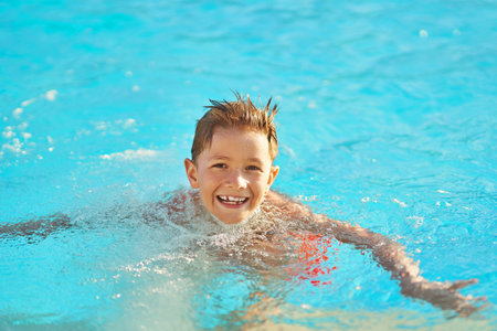 Picture of young boy playing in outdoor aqua park