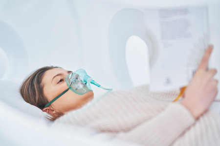Picture of brunette woman in oxygen cabinの写真素材