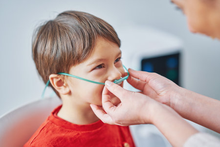 Picture of young boy having molecular hydrogen inhalationの写真素材