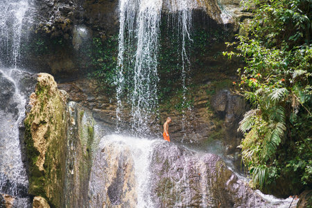 Photo of man walking on Gozalandia Waterfallの写真素材